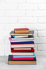 Stack of books on shelf.