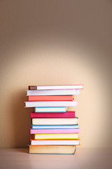 Stack of books on shelf.