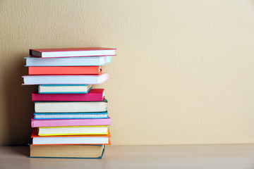 Stack of books on shelf.