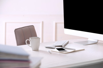 Naklejka premium Workplace with computer in room