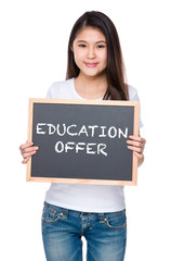 Young woman hold with chalkboard and showing education offer