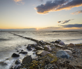 sea landscape, sea waves breaking on the breakwater