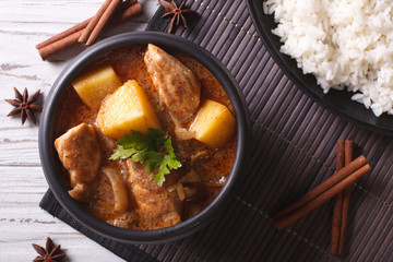 Thai massaman curry with chicken and rice closeup. horizontal top view

