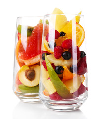 Fresh fruits salad in glasses isolated on white