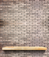 Wooden shelf on regular light orange brick wall,Template mock up