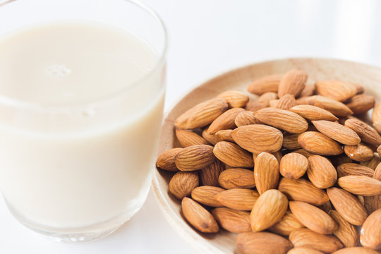 Almond milk and grain on white kitchen table