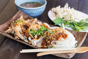 Noodles with pork and pork balls with Thai style on wooden plate
