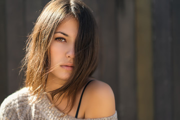 Portrait of a beautiful brunette. Close-up. Color toned.