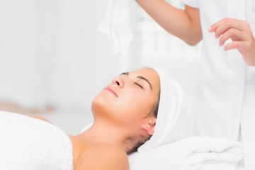 Obraz na płótnie Canvas Beautiful woman lying on massage table at spa center
