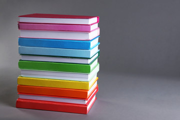 Colorful books on gray background