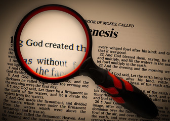 a focus, using a magnifying glass, on the words in Genesis 1v1