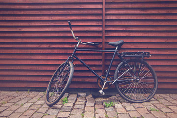 Naklejka na ściany i meble Classic Vintage Black Hipster Bicycle on the Street