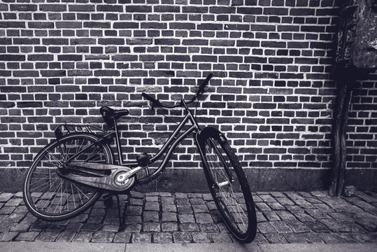 Unique Classic Vintage Hipster Bicycle Leaning Against The Street Wall