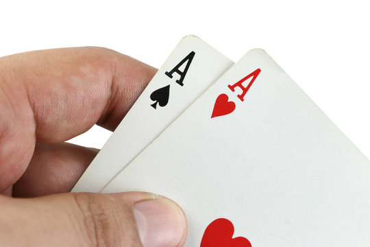 Double A playing cards in hand.