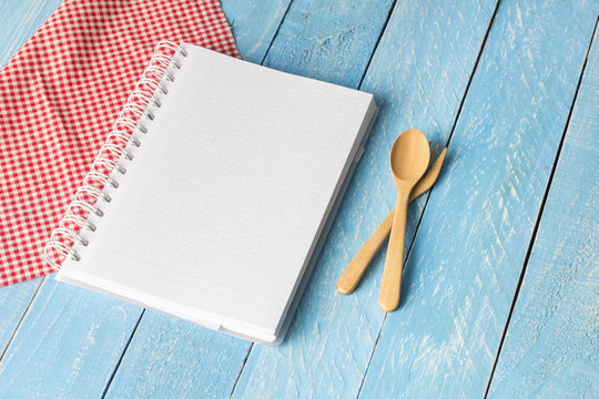 Notebook with wooden spoon on wood table Stock Photo | Adobe Stock