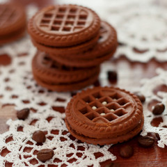 Chocolate cookies with sweet cream and coffee beans