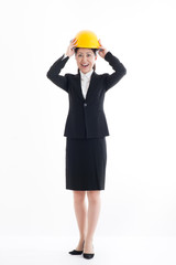 ヘルメットを被っているスーツの日本人女性,全身