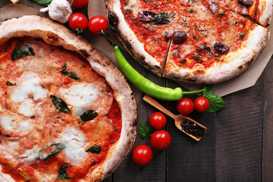 Delicious pizza on wooden table, closeup