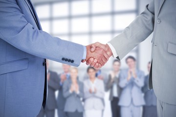 Composite image of side view of shaking hands