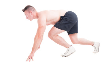 Side view of a man in running start position