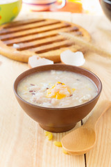 Traditional chinese brown rice gruel in white bowl, congee