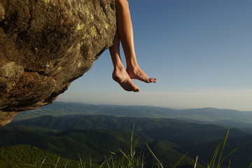 Female feet on high landscape