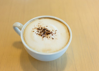 hot coffee on wooden table in the cafe