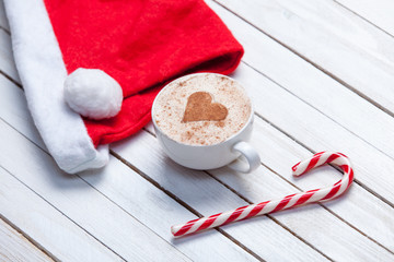 Cup of coffee and Santas hat