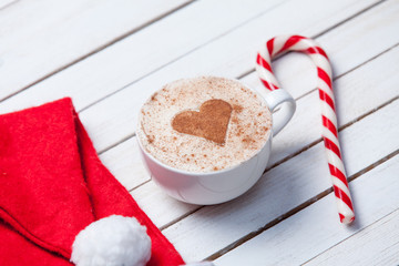 Cup of coffee and Santas hat