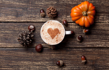 Cup and pine cone with acorn and pumpkin