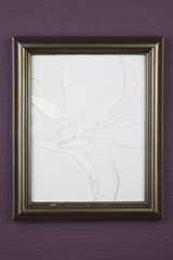 empty picture frame with broken glass