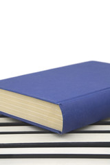 Group of books in a row and one book standing out 