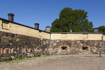 Fototapeta na wymiar Suomenlinna sea fortress is located off the coast of Helsinki, Finland. Suomenlinna is added to UNESCO´s list of World Heritage Sites as a unique monument to military architecture