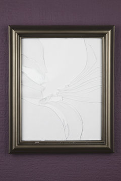 Empty Picture Frame With Broken Glass