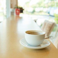 hot of coffee drink on wooden table bar in the cafe