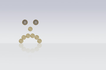 miserable face made out of one pound coins