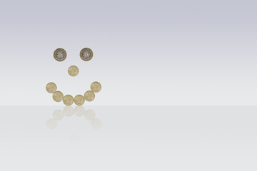 smiley face made out of one pound coins