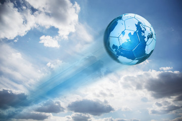 Naklejka premium Map of the globe on a blue leather football shooting in the sky