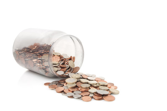 Money Jar full of bank of england coins,pound coins on top