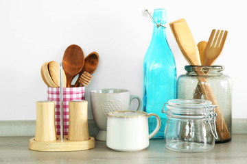 Composition with different utensils on wooden wooden table in kitchen