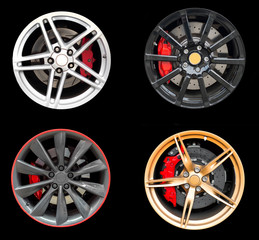 Obraz premium Collage of Four car rims isolated on black background.
