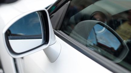 Obraz na płótnie Canvas Close-up of Rear-view mirror. Sports car part.