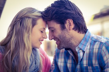  Cute couple sitting at a cafe head to head
