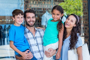 Happy family having fun in the mall