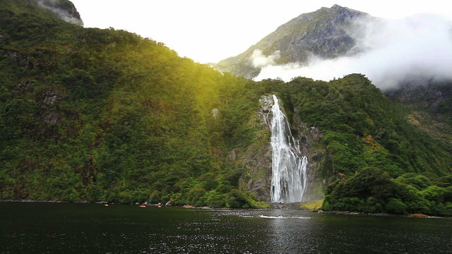 View on Lady Bowen Falls from boat, Milford Sound Fjord. South Island, New Zealand.