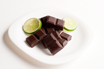 square of black chocolate and lime