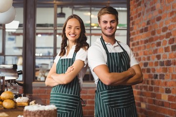 Smiling co-workers standing together