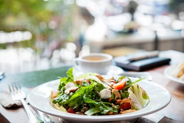 Zelfklevend Fotobehang plated salad of vegetables on wooden table  © psphotography