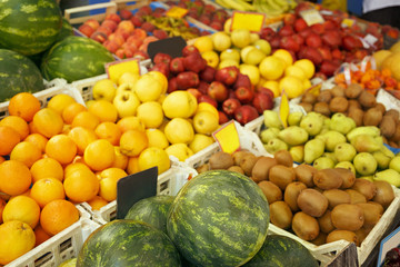 Fruit market/Fresh organic food. Healthy life style. Market shelves  filled with various fruits. Very shallow depth of field.