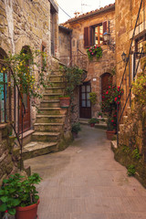 Fototapeta na wymiar Italian old ancient alley in the medieval Tuscan town
